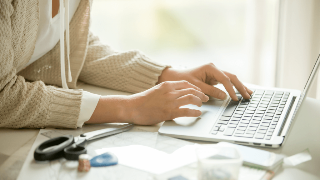 person typing on laptop